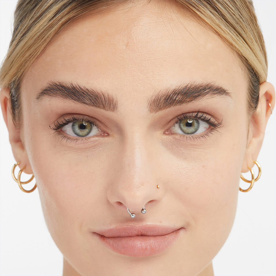 A close-up of a model wearing brow gel
